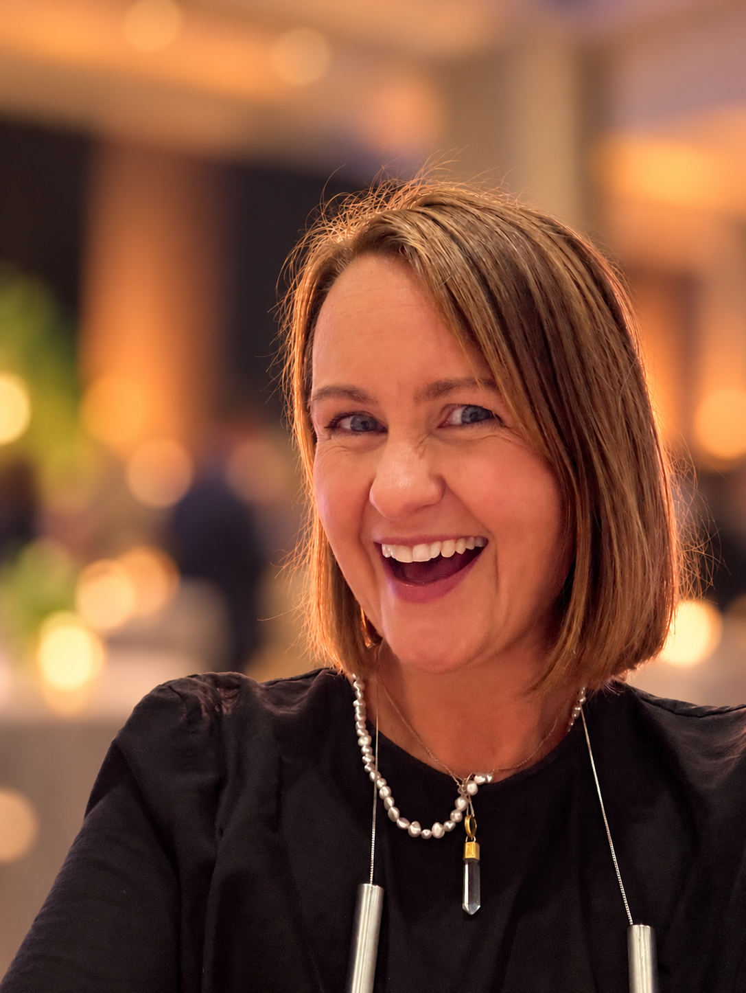Carly Osman Holme laughing at an evening event